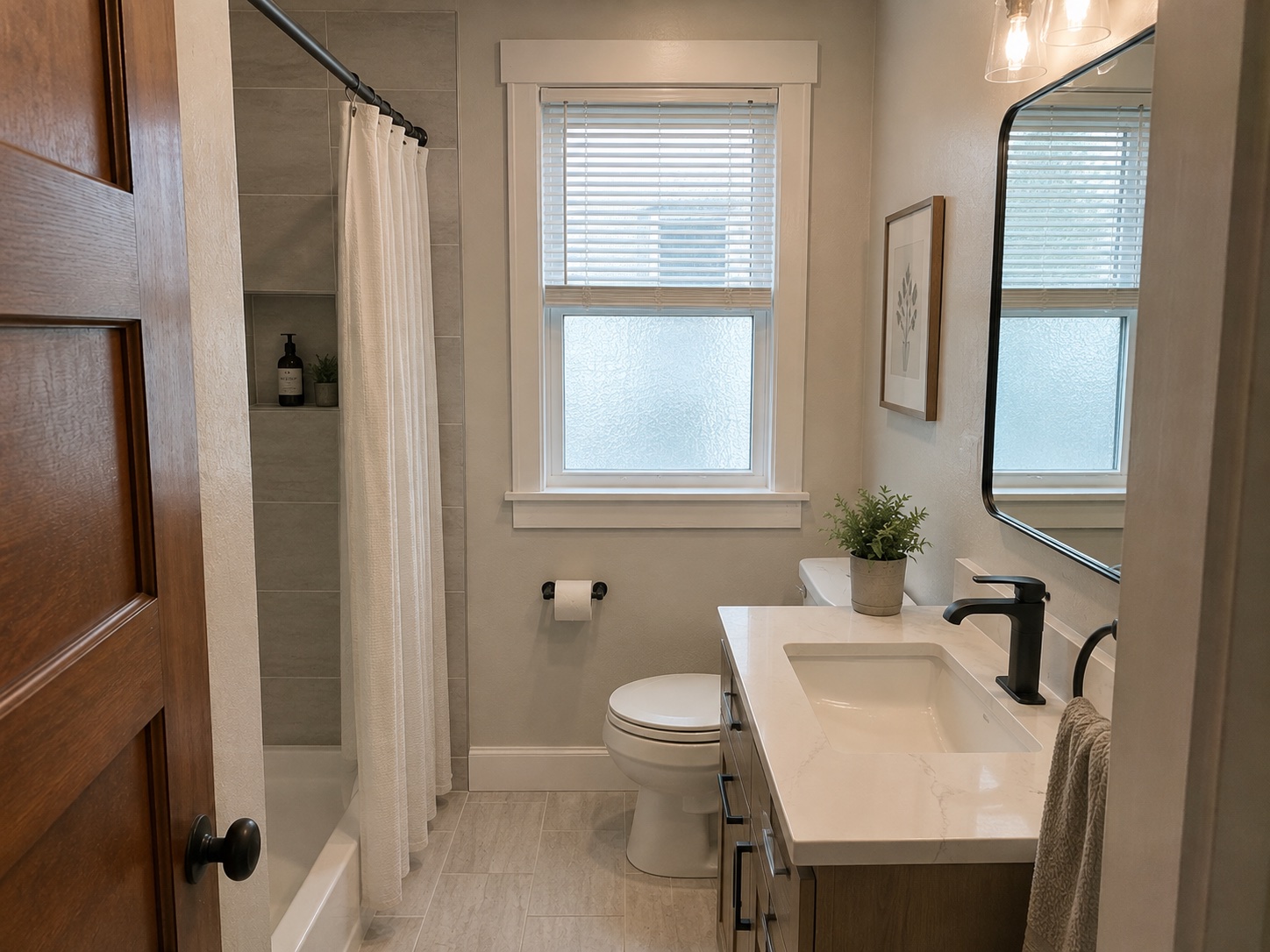 The same upstairs bathroom after a full remodel in the same layout