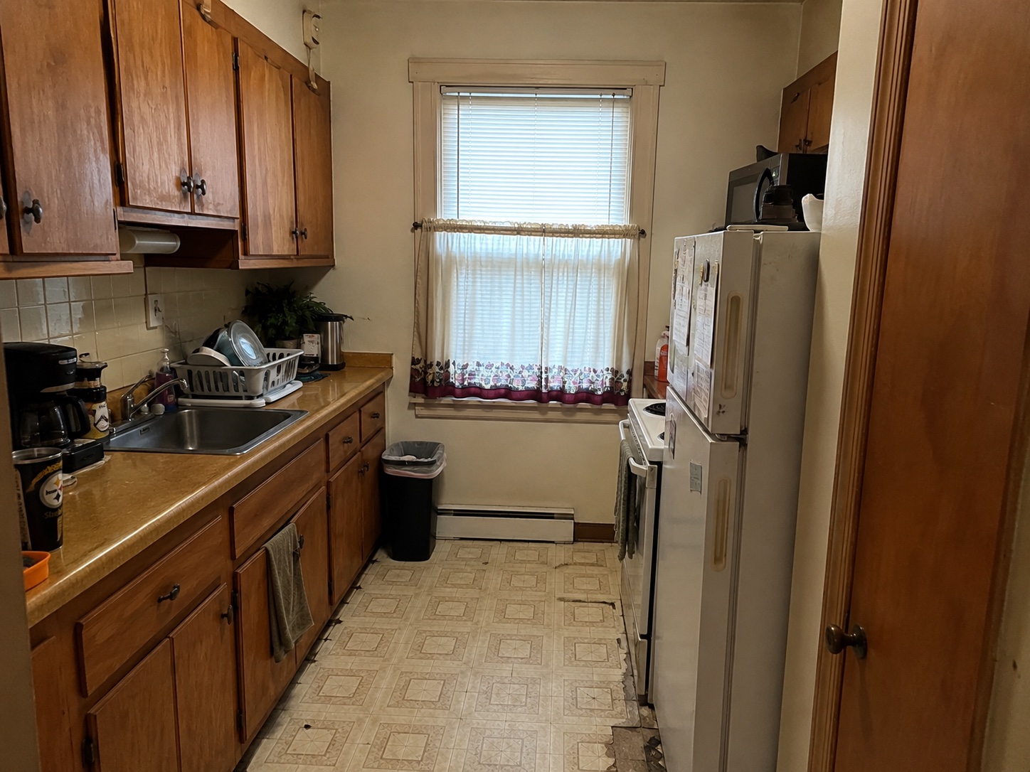 Small closed-off kitchen in a Scranton row home before remodeling